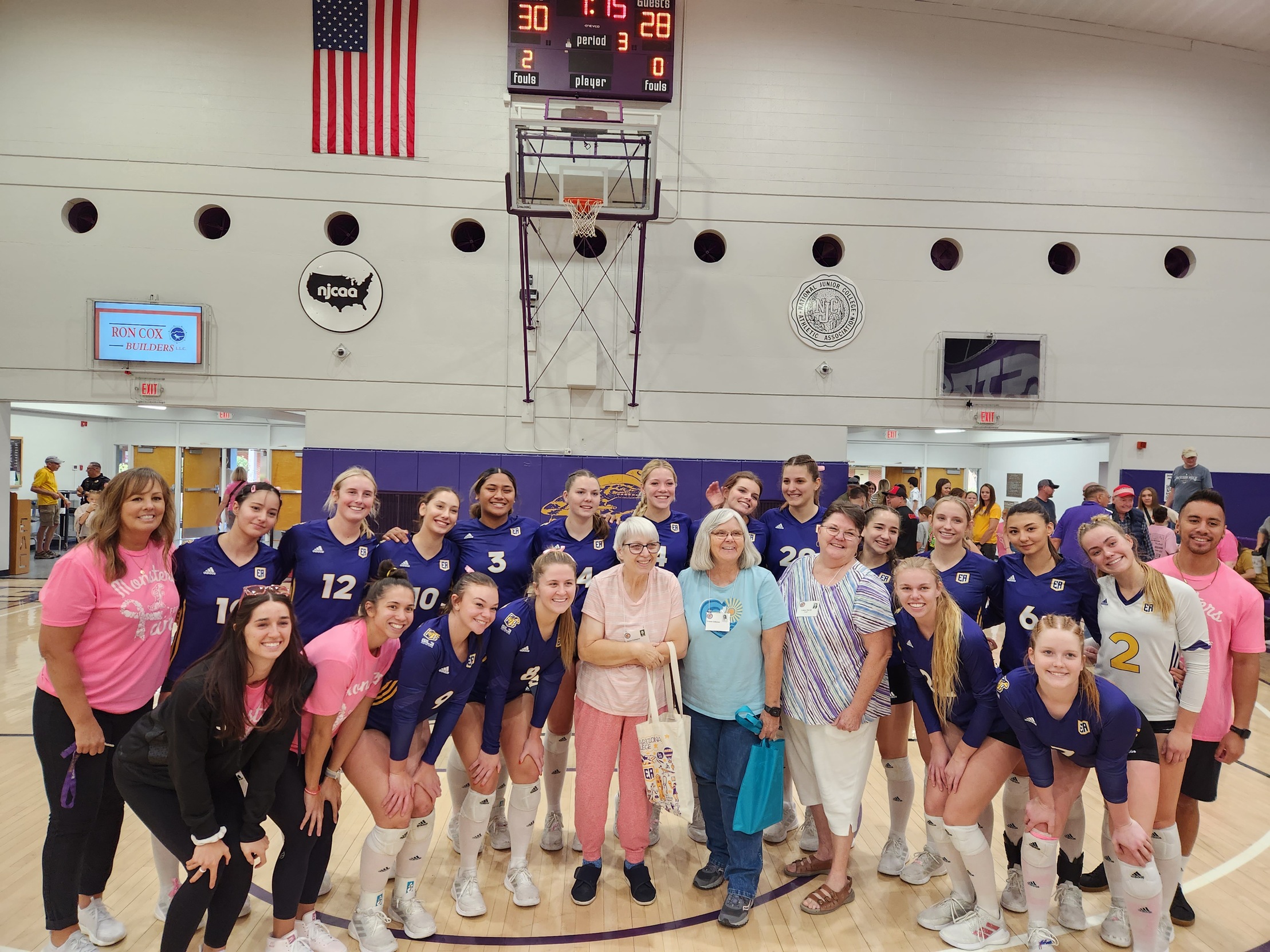 Eastern Arizona College’s Gila Monster Volleyball Team pose with members of the 1973 EAC Volleyball Team who won the AIAW national championship 50 years ago.